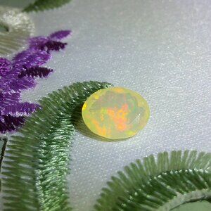 JTV Faceted Ethiopian Opal 9x7mm Oval 1ctw Loose Gemstone